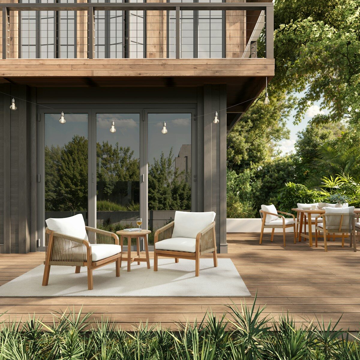 Outdoor seating area with chairs and table on deck.